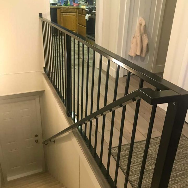 close up of a hand railing of a house going to the basement